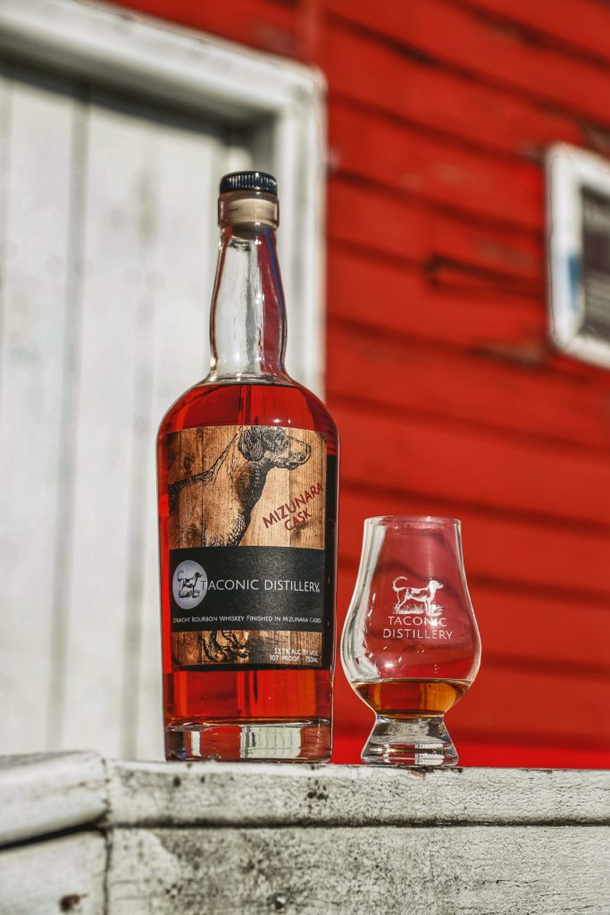 bottle with a red barn