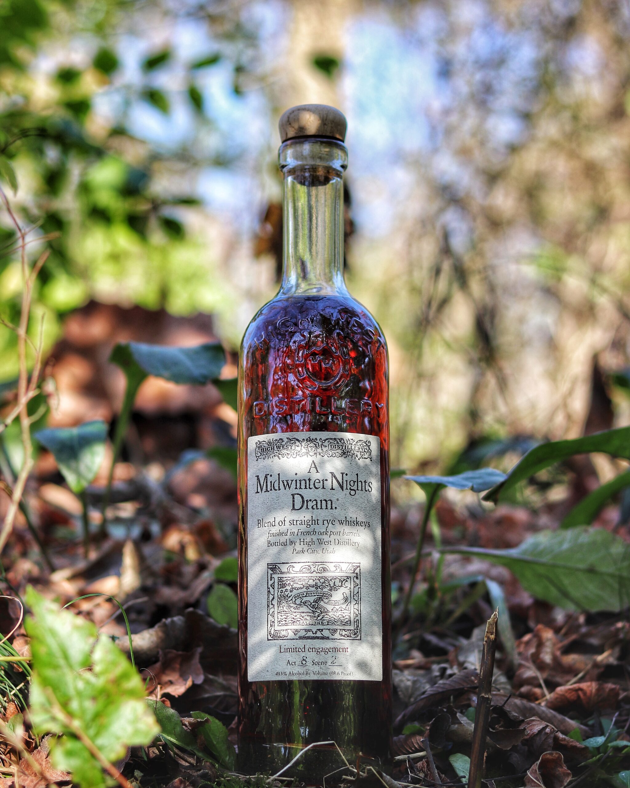Whiskey Bottle in the fall foliage of Kentucky. A Midwinter Night’s Dram