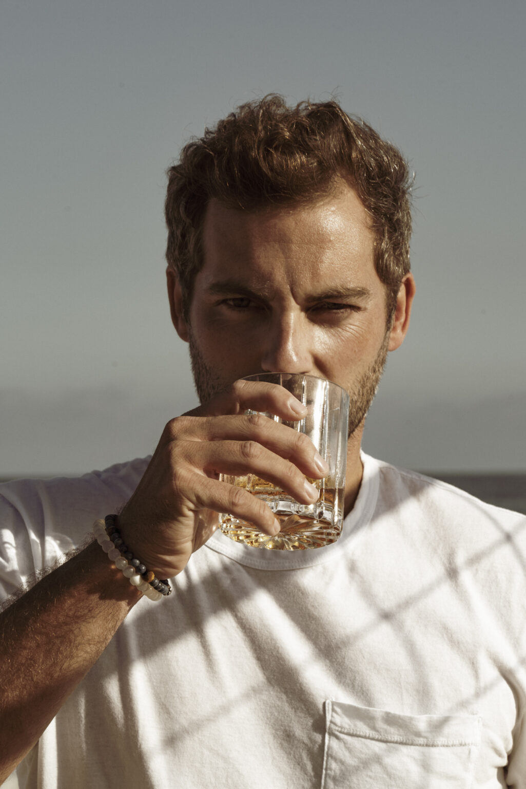 Jake Ireland drinking whiskey