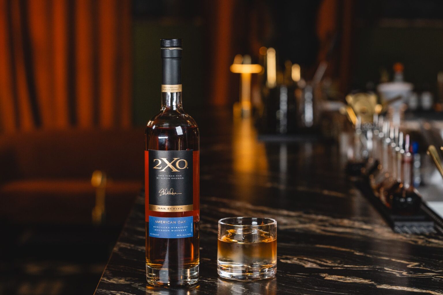 2xo bottle with bourbon glass