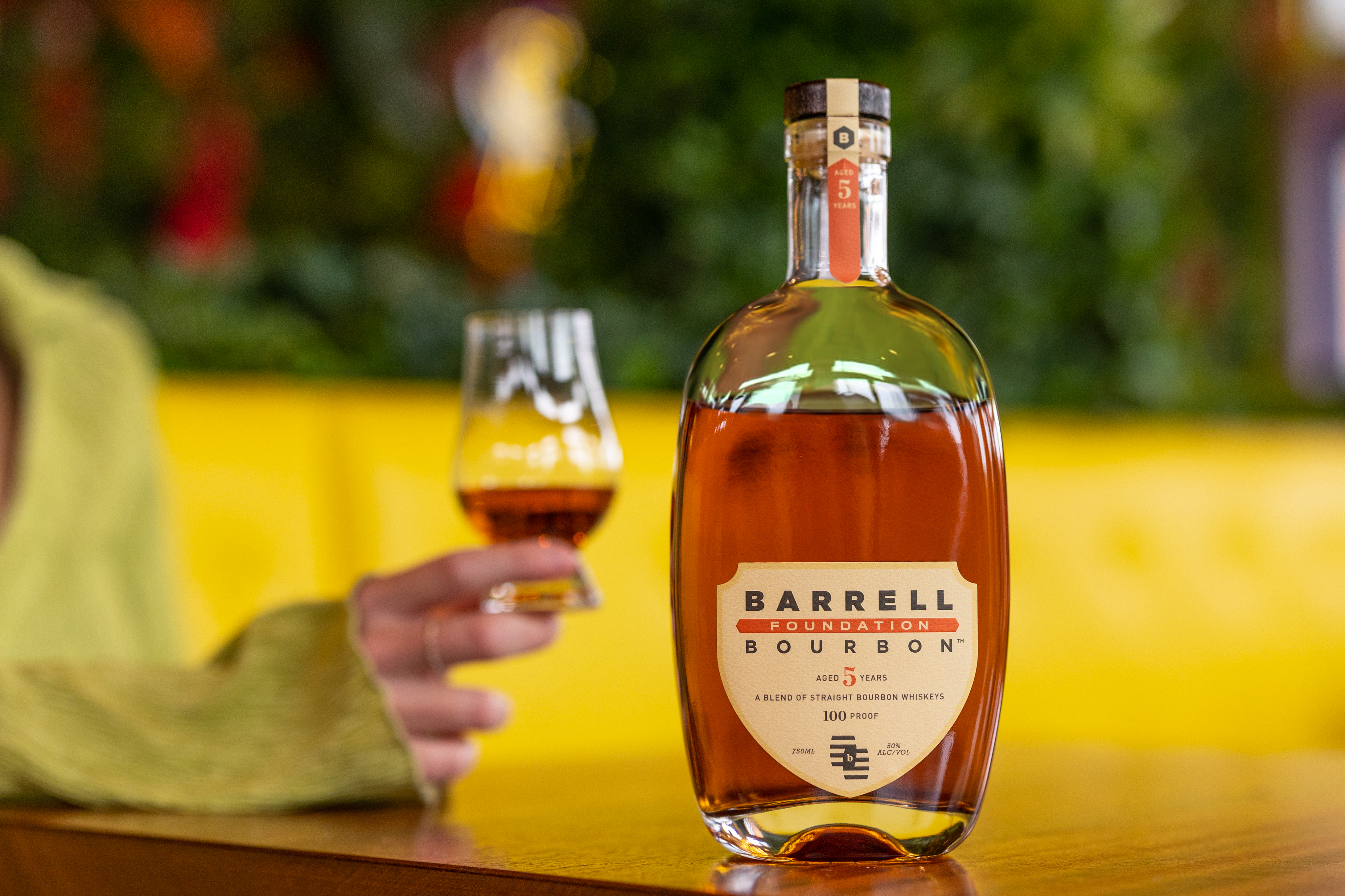 Barrell Bourbon Foundation with a woman holding a glass