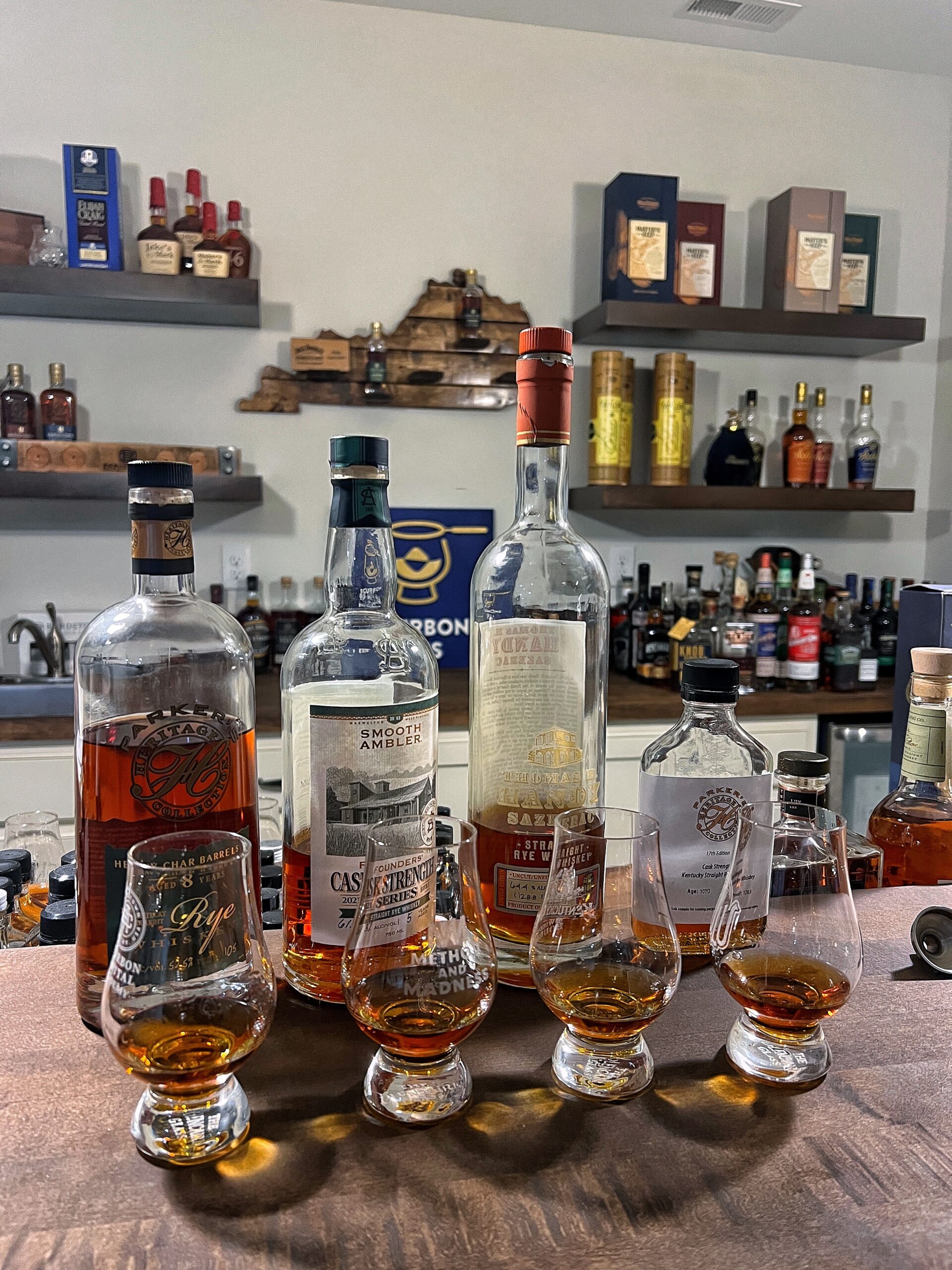 Parker's Heritage Rye Whiskey, Thomas H Handy, and Smooth Ambler Founders on a bar back