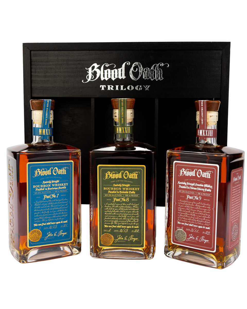 ux Row Distillers’ Blood Oath Trilogy – Third Edition, featuring a custom black wooden display box with bottles of Pacts 7, 8, and 9.