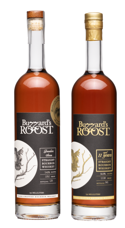 Buzzard’s Roost 7-year-old and 11-year-old double-oaked bourbons on display, showcasing their rich amber color and elegant bottle design at Whiskey Row.