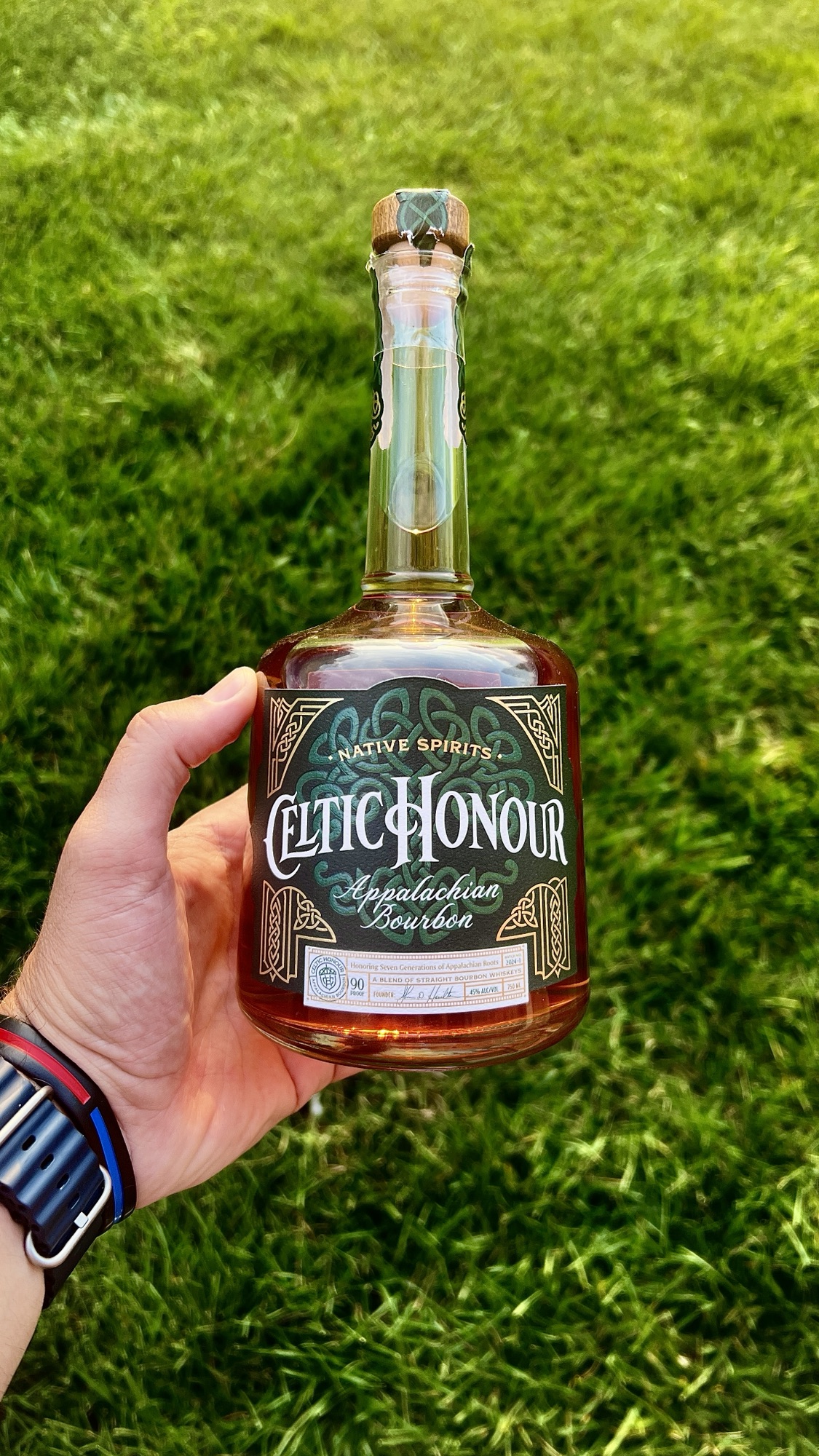 Celtic Honour Batch 1 in hand with a green lawn.