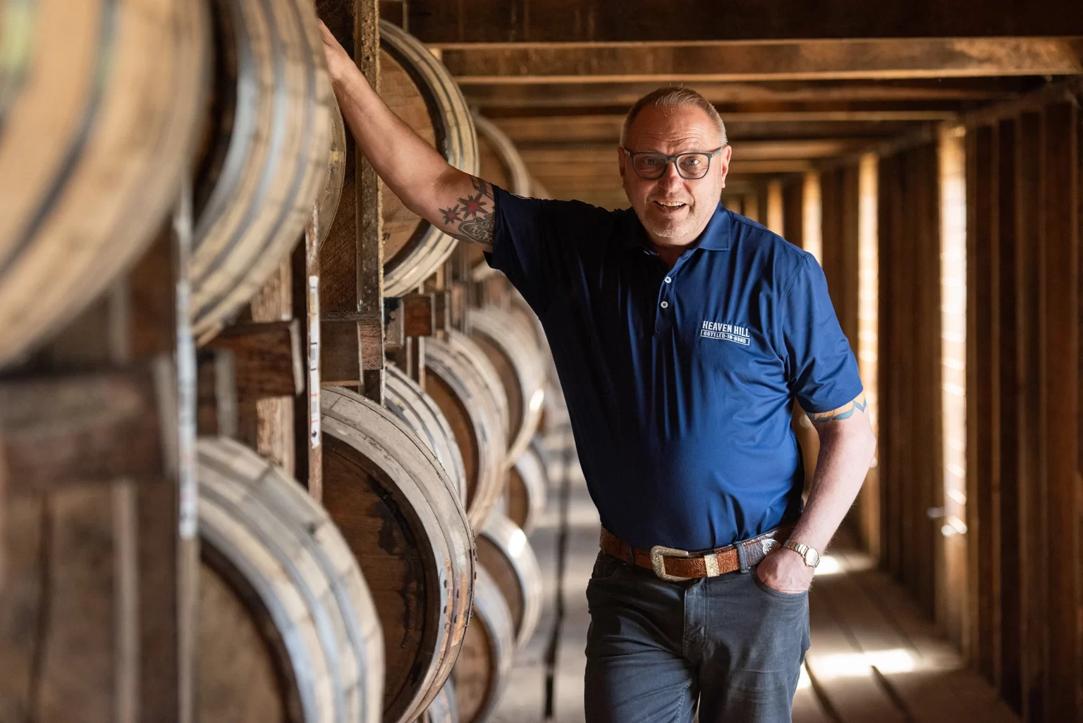 Bernie Lubbers, Heaven Hill Whiskey Ambassador Emeritus, with bourbon bottle.