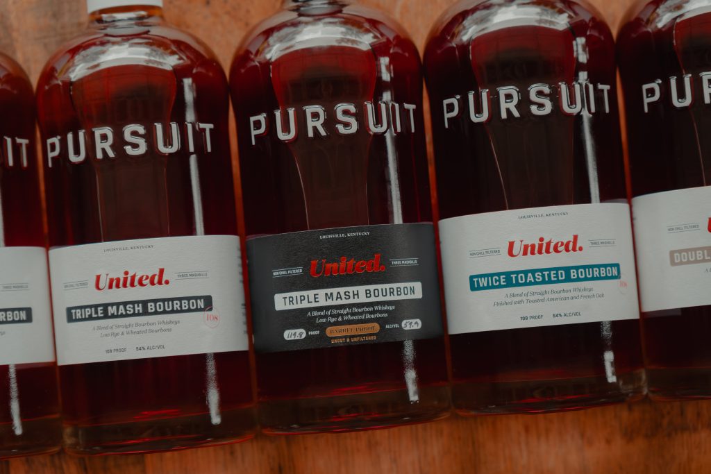 New Pursuit United Bourbon and Rye bottles with redesigned packaging on Whiskey Row, Louisville.