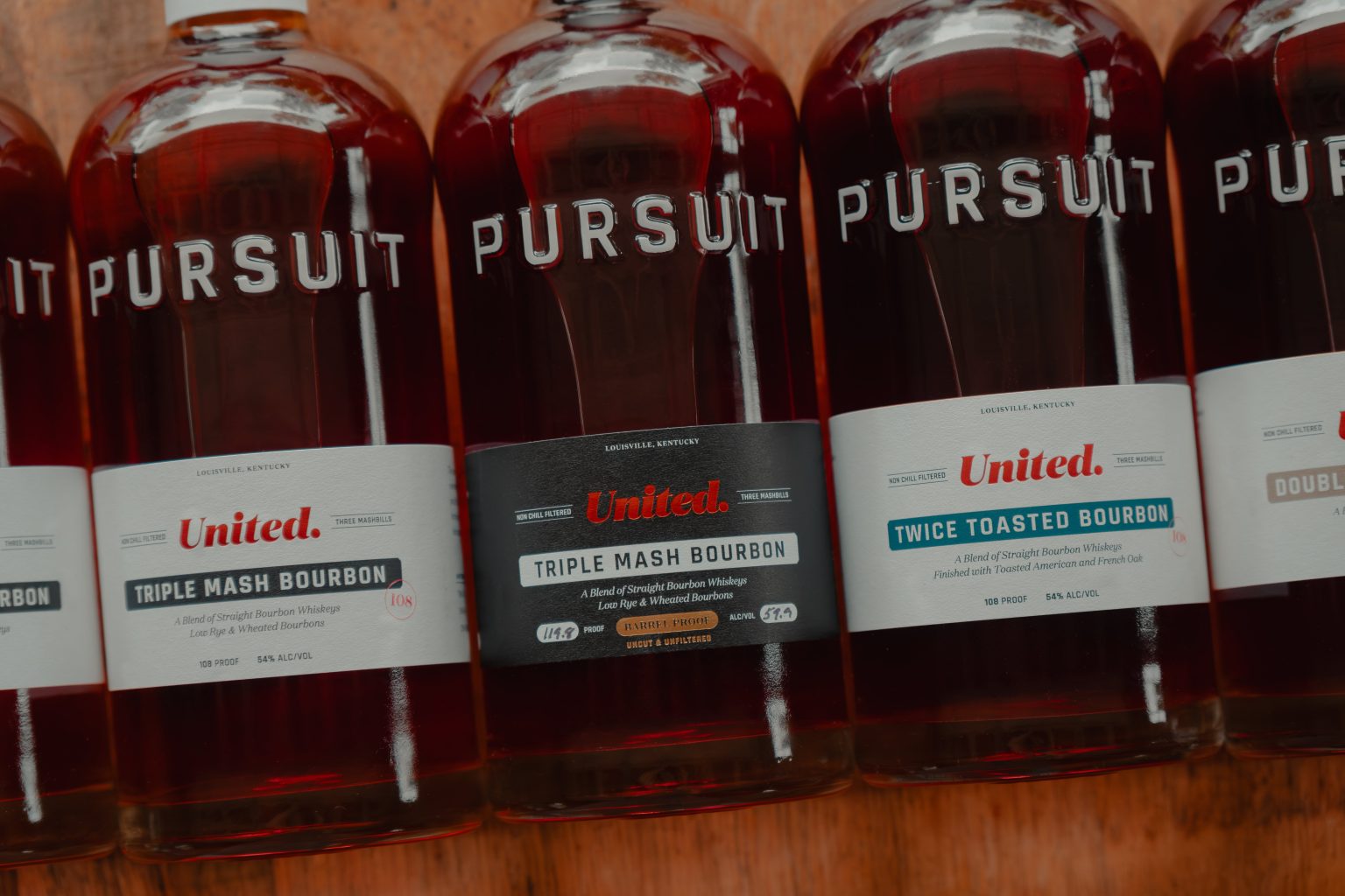 New Pursuit United Bourbon and Rye bottles with redesigned packaging on Whiskey Row, Louisville.