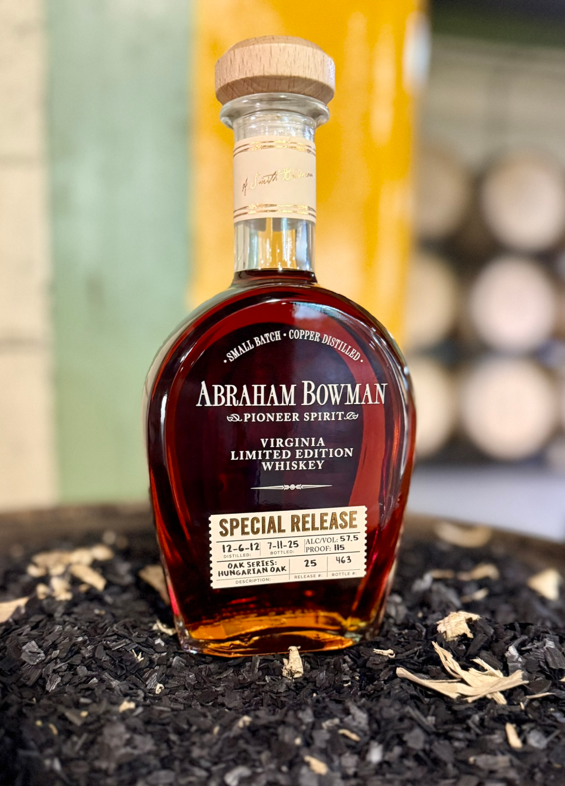 bottle sitting on a barrel