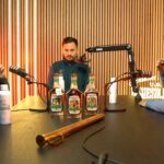 Three men tasting bourbon and recording a podcast at the James B. Beam Distilling Co.