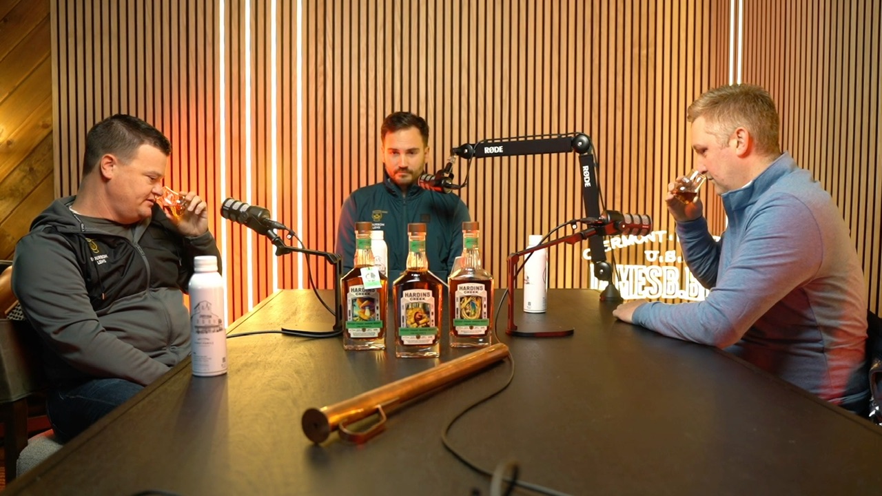 Three men tasting bourbon and recording a podcast at the James B. Beam Distilling Co.