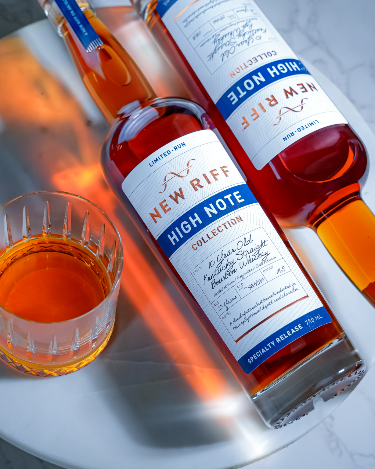 New Riff High Note 10 year bourbon and rye whiskey with a glass poured