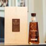 Four Roses Anthology Chapter 1 with a background and wooden box